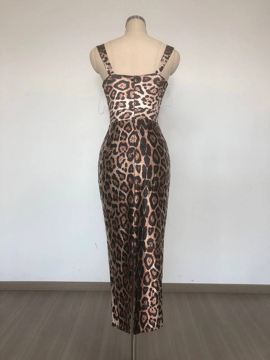 Woman wearing leopard print bodycon midi dress with bustier neckline and wide straps.
